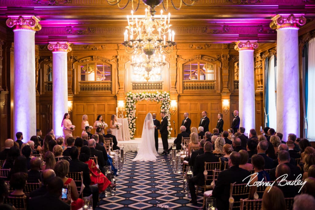 A couple is walking down the aisle at their wedding.