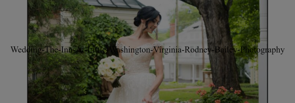 A bride in her wedding dress holding flowers.