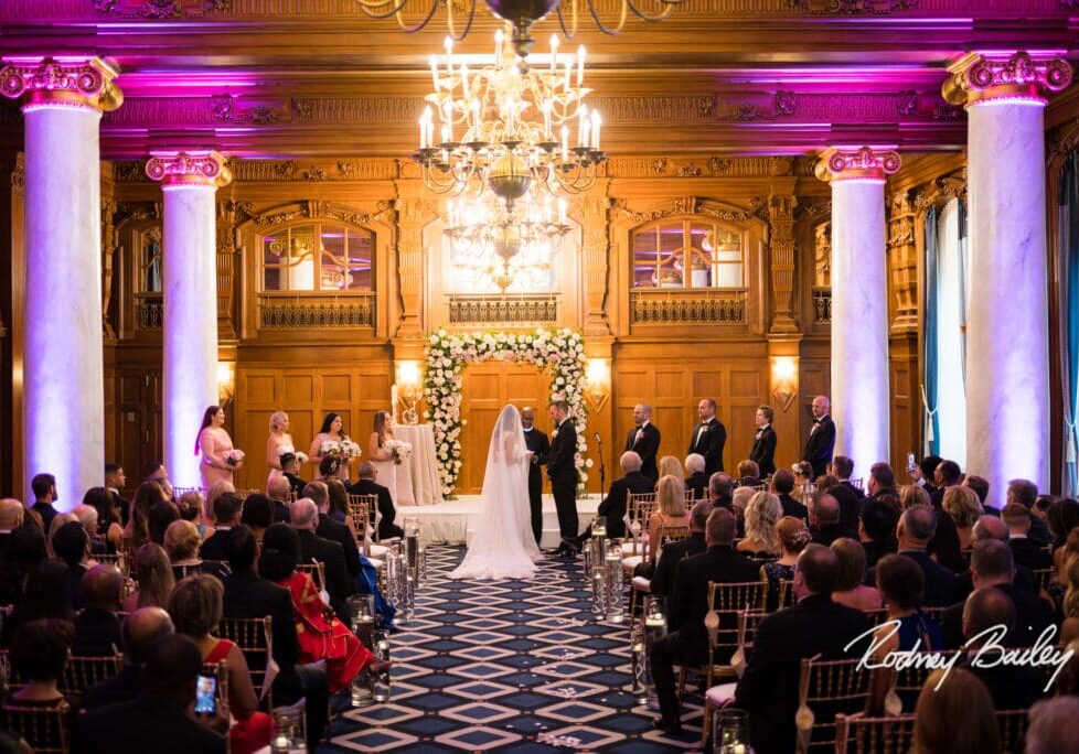 A couple is walking down the aisle at their wedding.